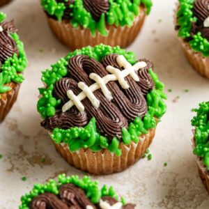 Cupcakes decorated like footballs.