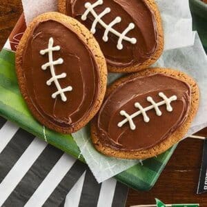 Peanut butter cookies decorated to look like footballs.