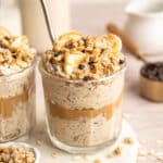 Peanut butter overnight oats topped with granola, banana slices and chocolate chips.