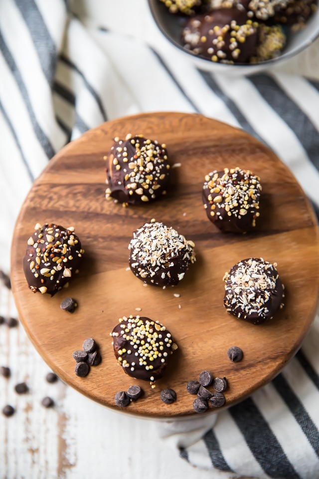 These healthy Chocolate Almond Butter Bites are a perfect treat for any party and a tasty option for those with peanut allergies. They seriously taste like a decadent dessert but are made with NO grains, eggs, or refined sugars. They’re gluten-free, vegan, and a healthy and delicious way to satisfy those chocolate cravings!