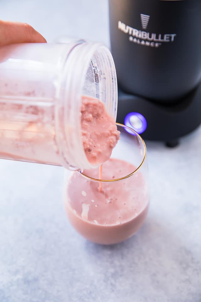 This Tickled Pink Strawberry Peach Protein Smoothie made with a combo of two of my favorite fruits is packed with protein, antioxidants, vitamin C, and potassium. It's also simple, fruity and refreshing! The perfect treat for breakfast, snack, or even dessert! 