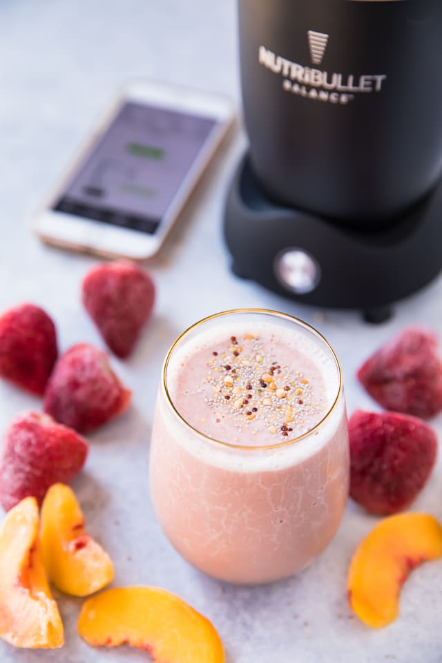 This Tickled Pink Strawberry Peach Protein Smoothie made with a combo of two of my favorite fruits is packed with protein, antioxidants, vitamin C, and potassium. It's also simple, fruity and refreshing! The perfect treat for breakfast, snack, or even dessert! 