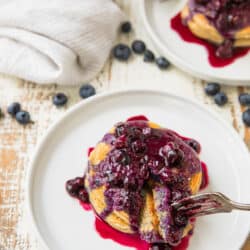 These Healthy Greek Yogurt Pancakes With Blueberry Pineapple Syrup are light, fluffy and so good. They're made with wholesome ingredients and then topped with a refined-sugar free blueberry-pineapple syrup, that takes these pancakes to the next level!