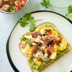 This Mexican Egg Bacon Avocado Toast is simply one of the best breakfast solutions of all time. It's made in less than 10 min from start to finish, and is super delicious with endless options. Have you jumped on the avocado toast bandwagon? Yes? Well, enjoy my favorite avocado toast recipe idea!