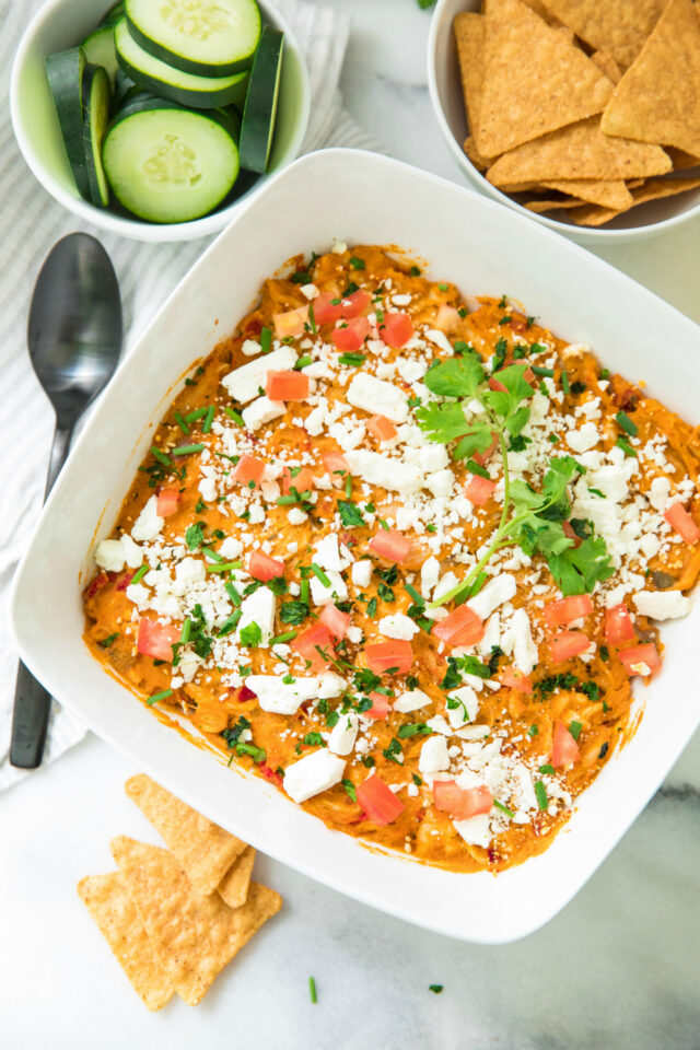 Easy Southwest Chicken Baked Hummus Dip is a protein-packed, stick-to-your-ribs dip! It's not only the perfect meal-type appetizer, but it’s also the ultimate crowd-pleasing dip!
