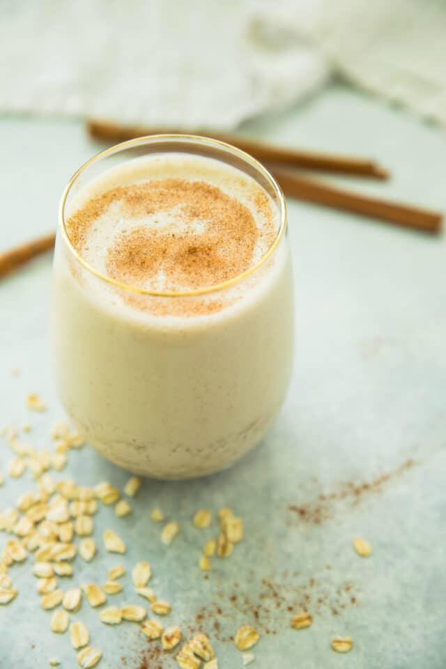 cinnamon roll protein shake served in a glass