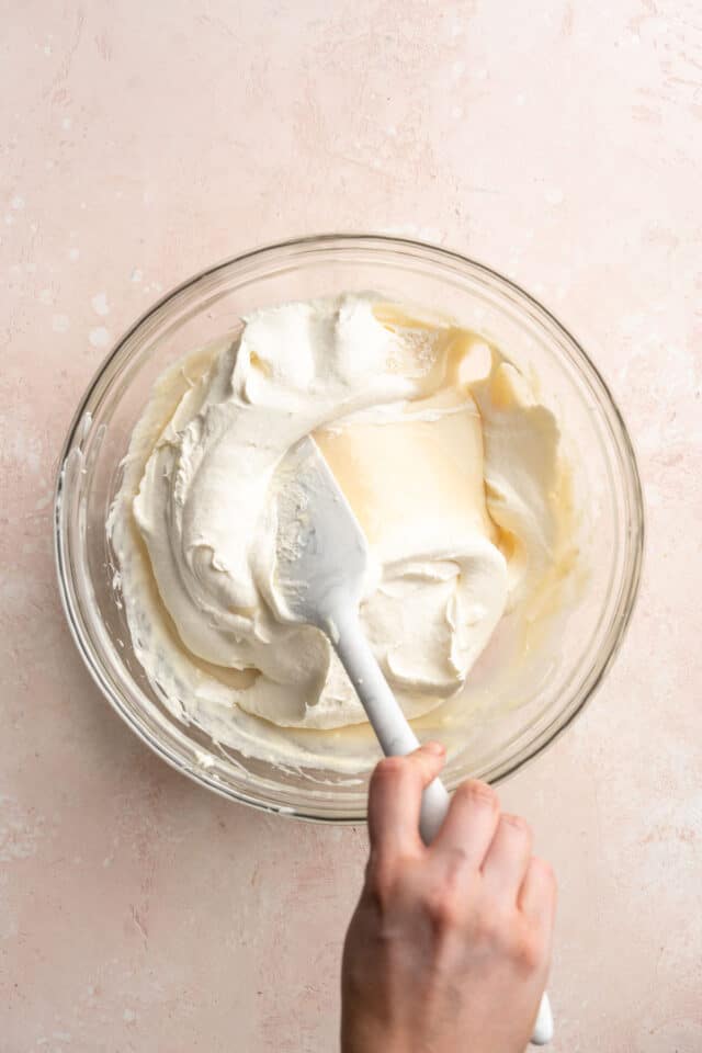Stirring Cool Whip into cream cheese mixture.