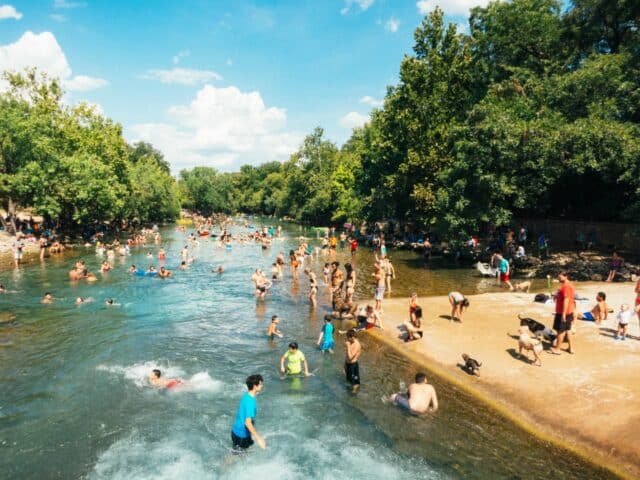 people playing in natural springs
