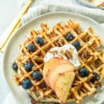 healthy protein waffle recipe topped with sliced apples, Greek yogurt and blueberries