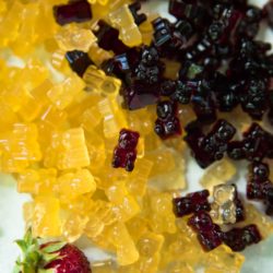 overhead view of yellow and dark red gummy bears