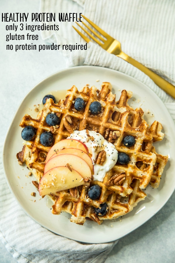 Pinterest photo of Healthy Protein Waffle Recipe topped with Greek yogurt, sliced apples, pecans and blueberries