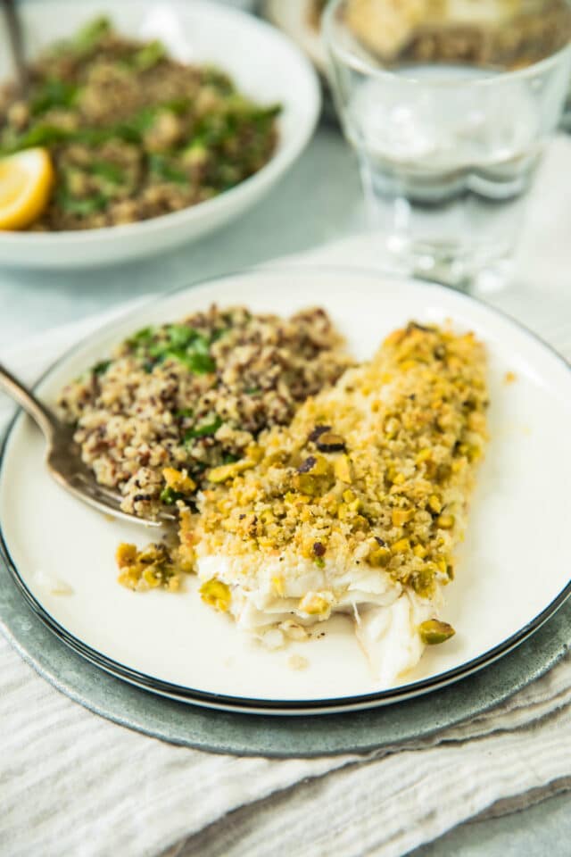side view of Healthy Pistachio Crusted White Fish with bite taken out