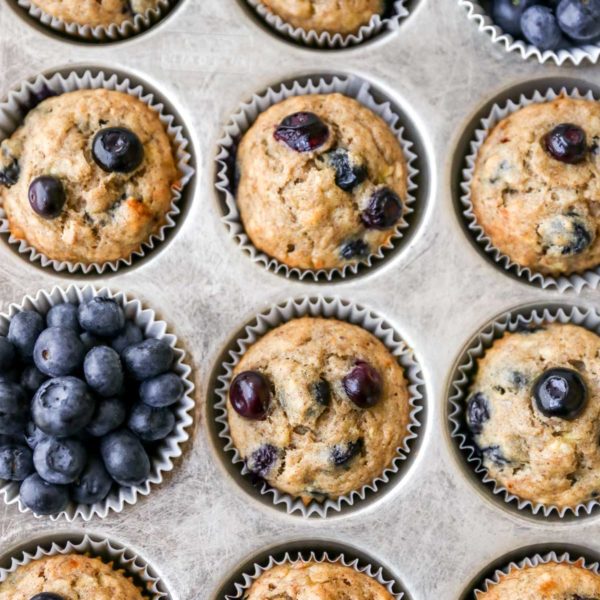 blueberry banana muffins in a baking pan