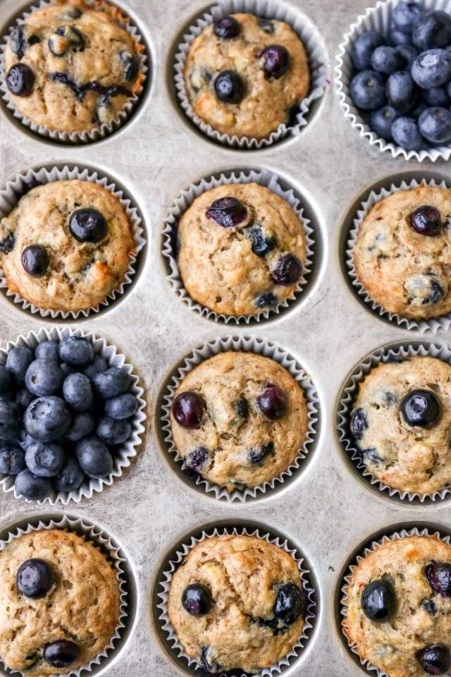 blueberry banana muffins in a baking pan