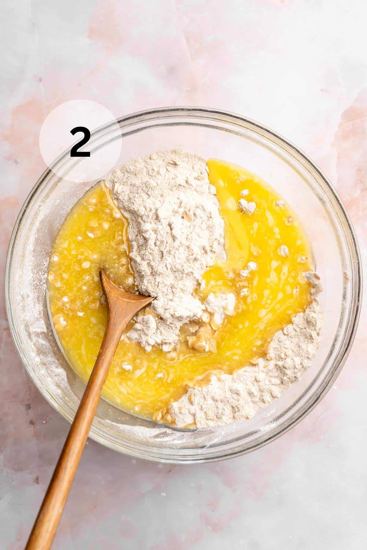 Mixing in melted butter and egg.