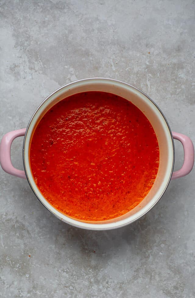 Red pepper sauce in a large pot.