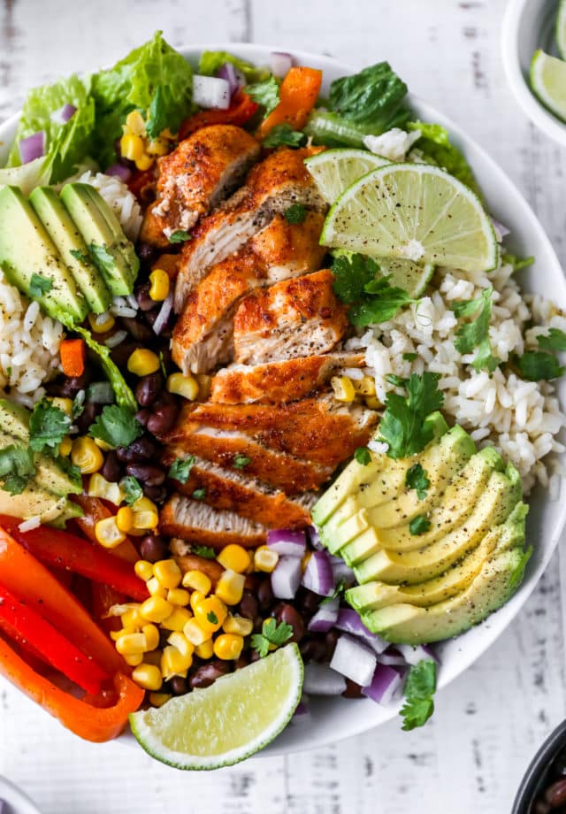 chicken burrito bowl made with rice, bell peppers and corn
