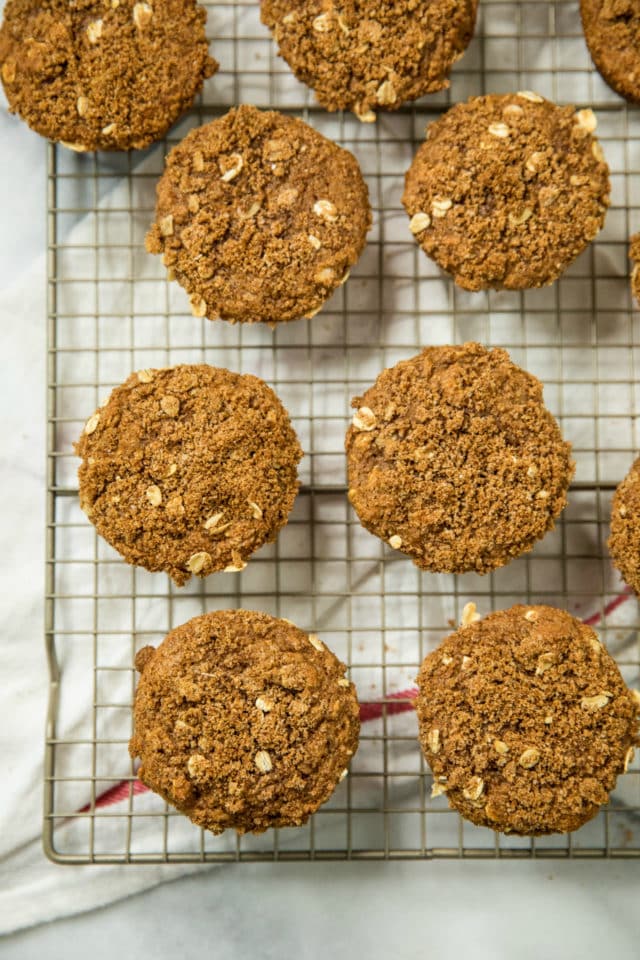 overhead view of Healthy Apple Spice Crumb Muffins on a wire cooling rack 