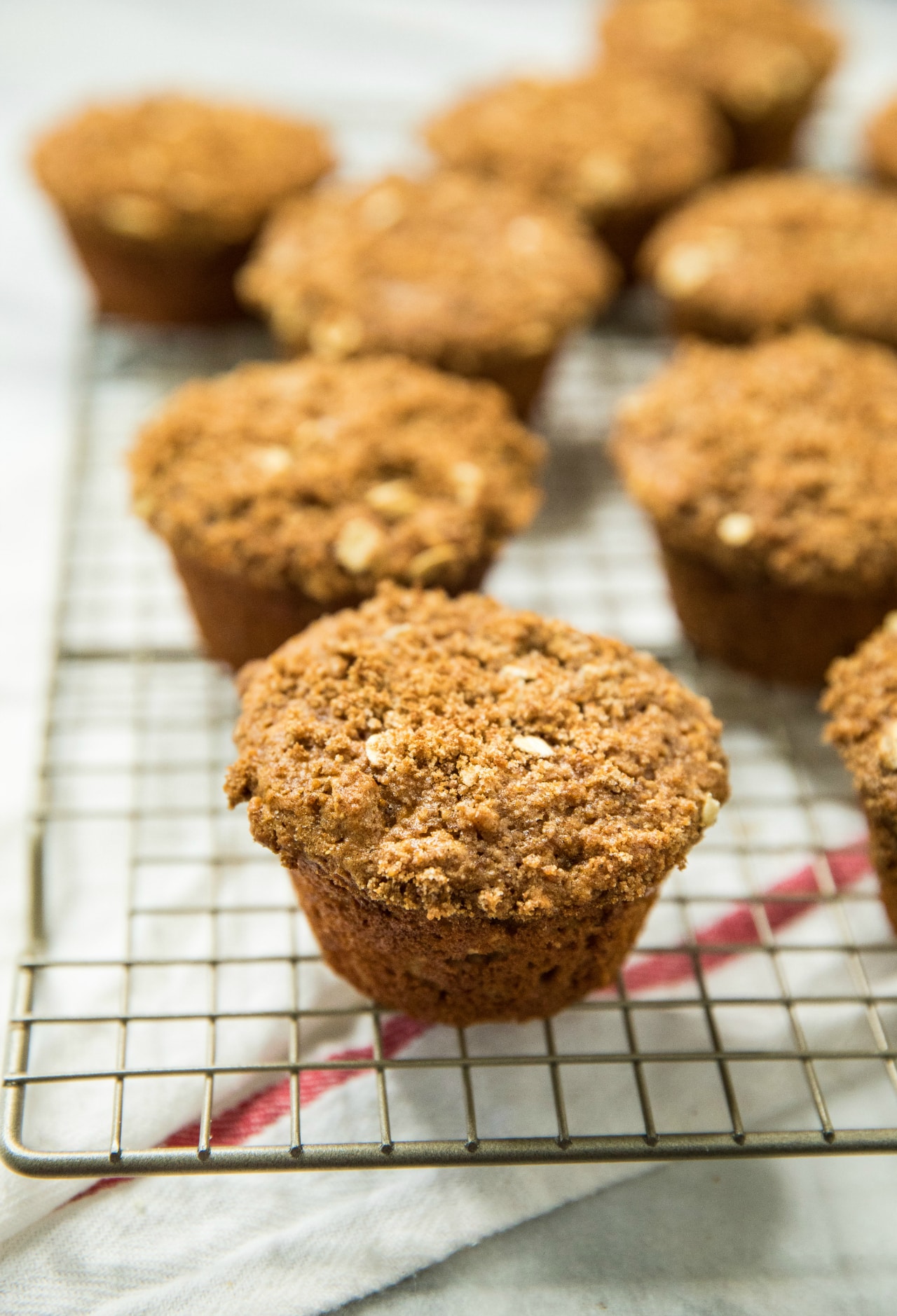 Healthy Apple Spice Crumb Muffins on a wire cooling rack