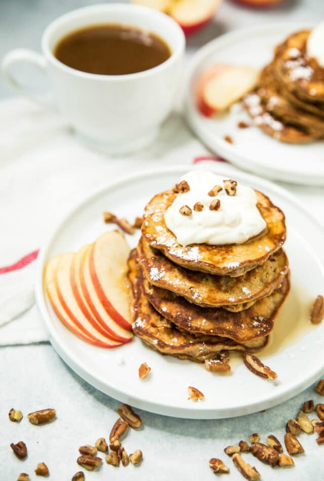 a stack of Apple Cinnamon Protein Pancakes on a white plate