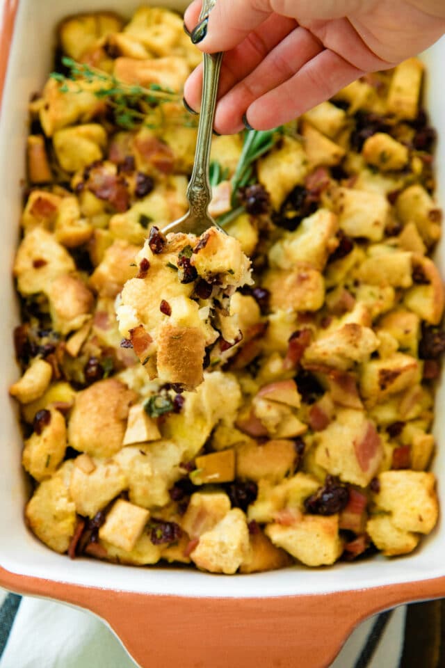 overhead closeup photo of Easy Bacon Apple Stuffing Recipe with a spoonful