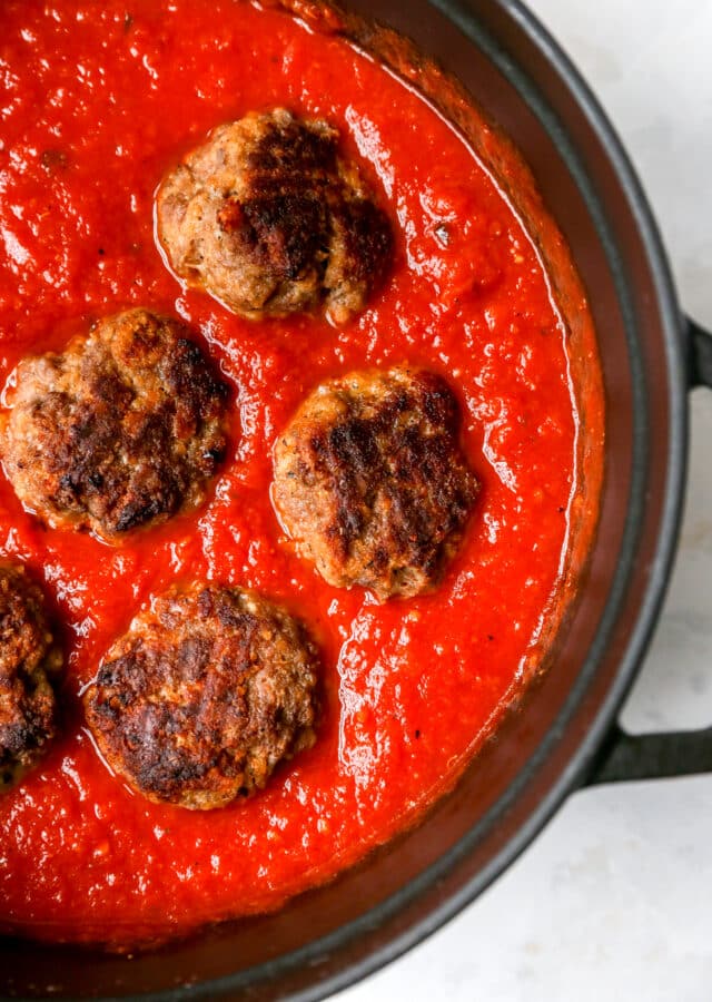 meatballs cooking in tomato sauce