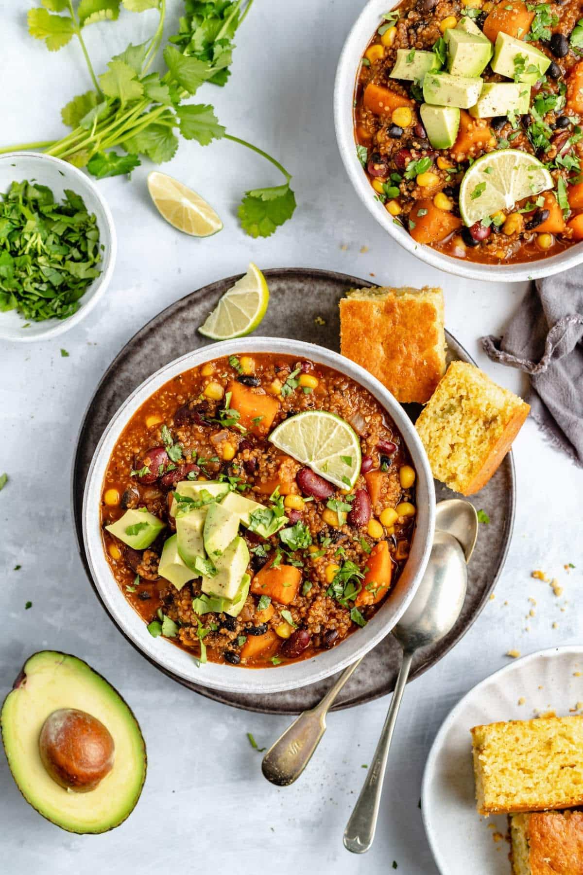 Chili topped with avocado and served with cornbread.