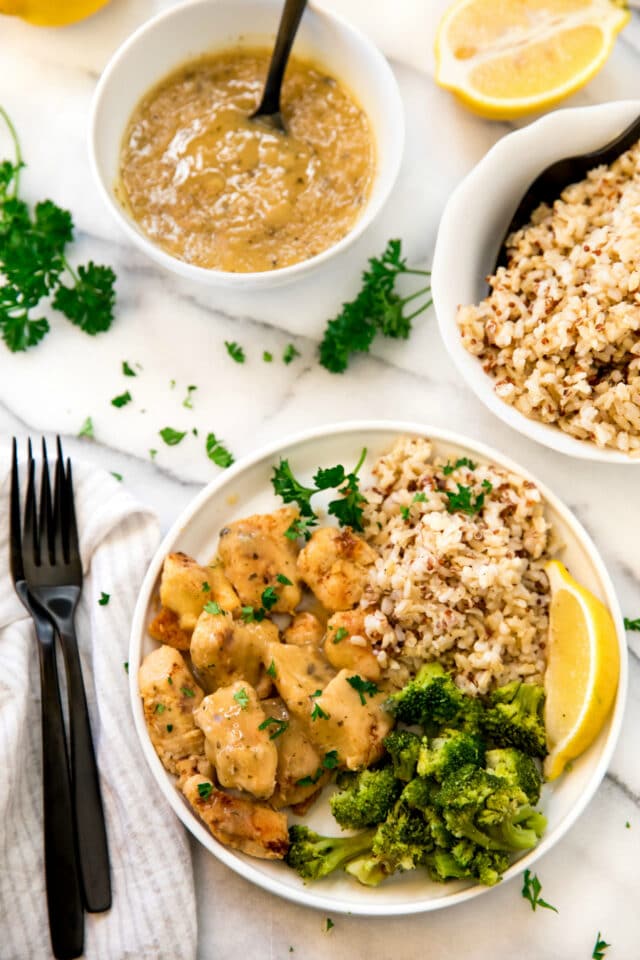 family meal with gravy, chicken, broccoli, and rice