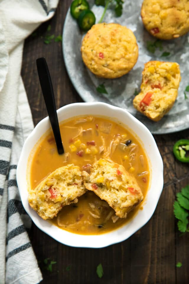 Mexican cornbread muffin in a bowl of soup