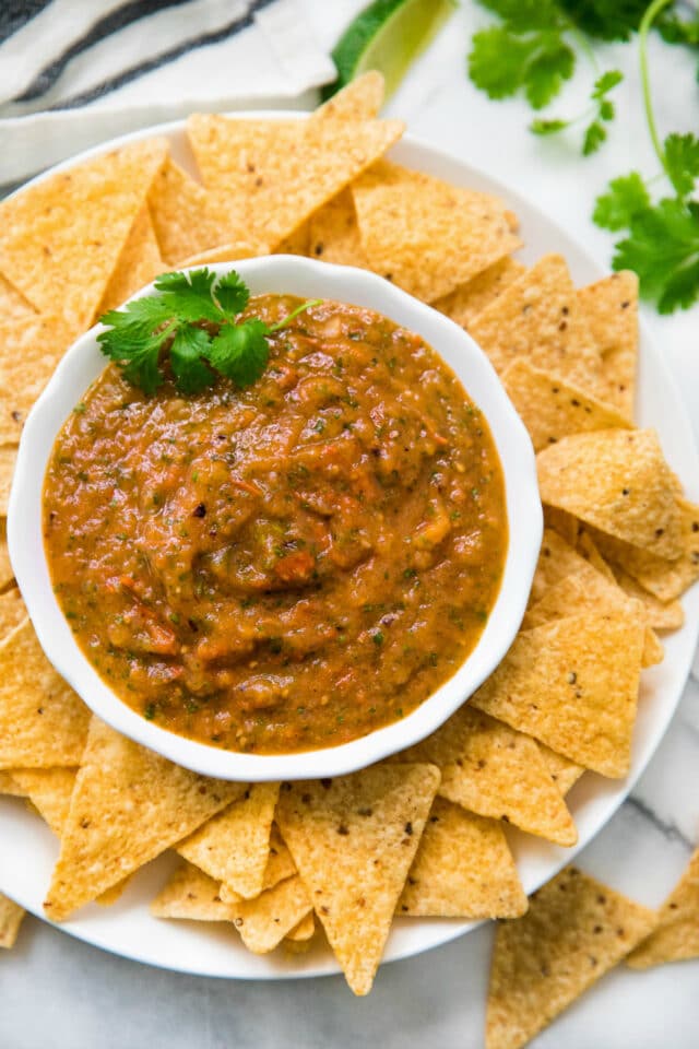 roasted salsa in a white bowl served with tortilla chips 