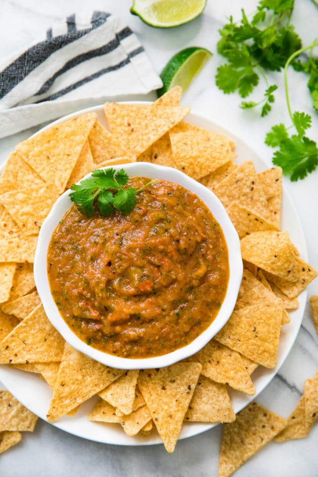roasted salsa served in a white bowl with tortilla chips