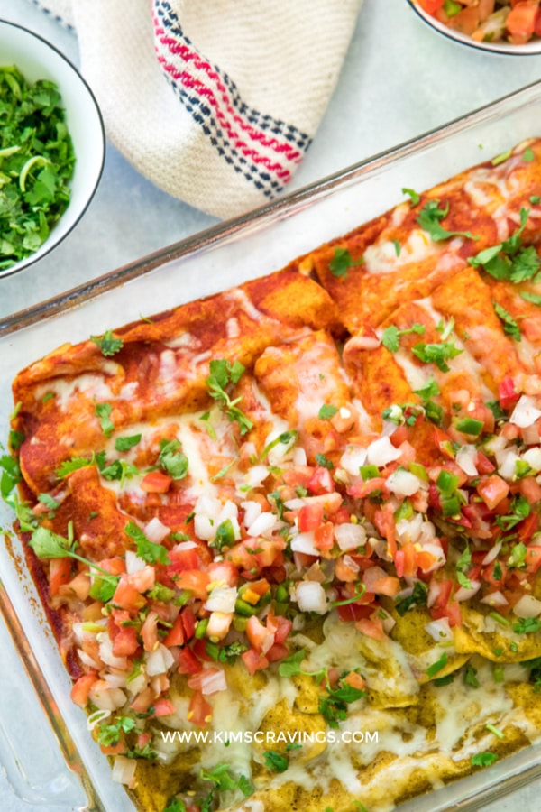 red and green sauce chicken enchiladas in a glass baking dish