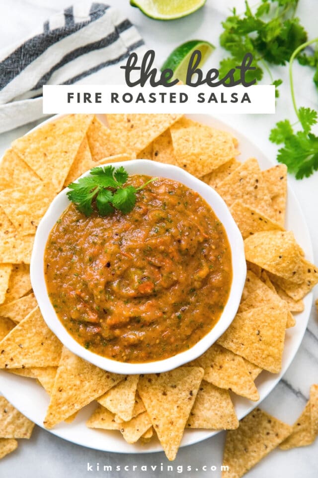 roasted salsa served in a white bowl with tortilla chips and topped with cilantro