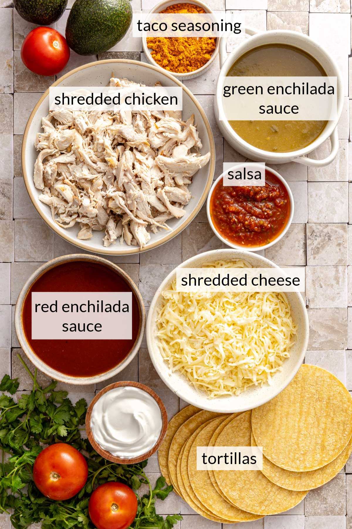 Bowls with shredded chicken, enchilada sauce, cheese and taco seasoning.