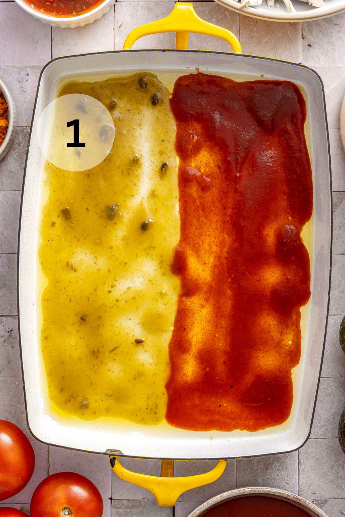 Red and green enchilada sauce spread in a pan.