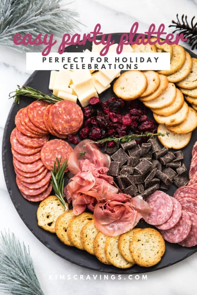 cheese board with meats, cheeses, and crackers