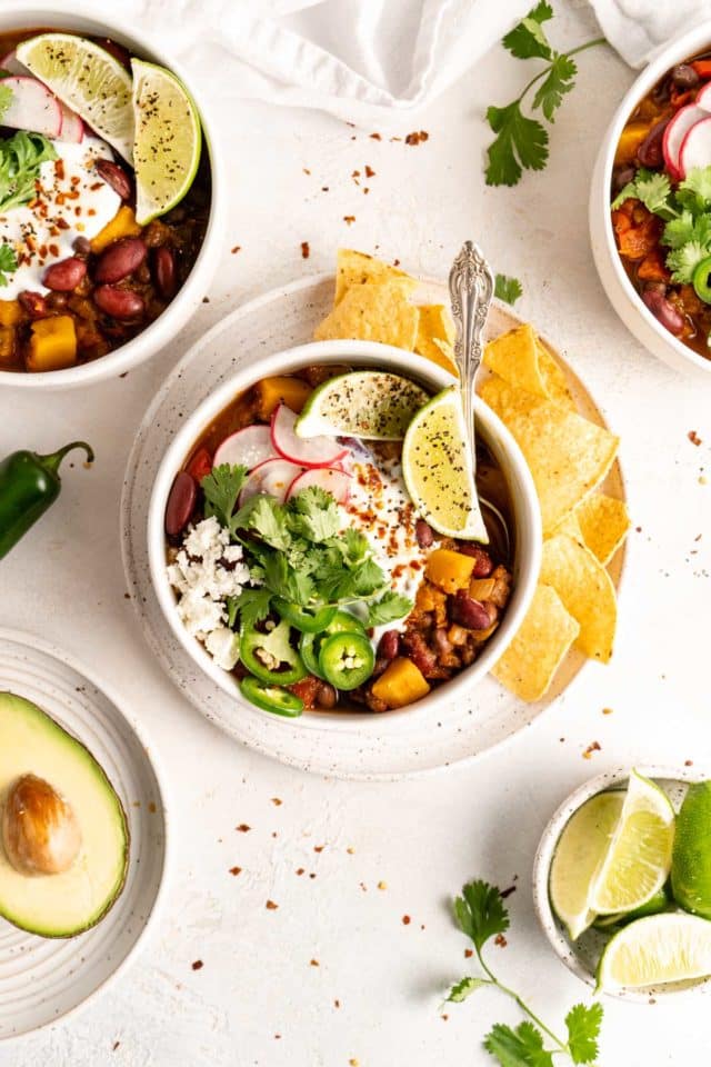 butternut squash chili topped with sliced jalapeños, radishes and sour cream 