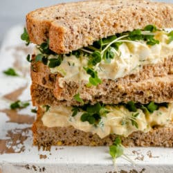 healthy egg salad sandwich served on wheat bread