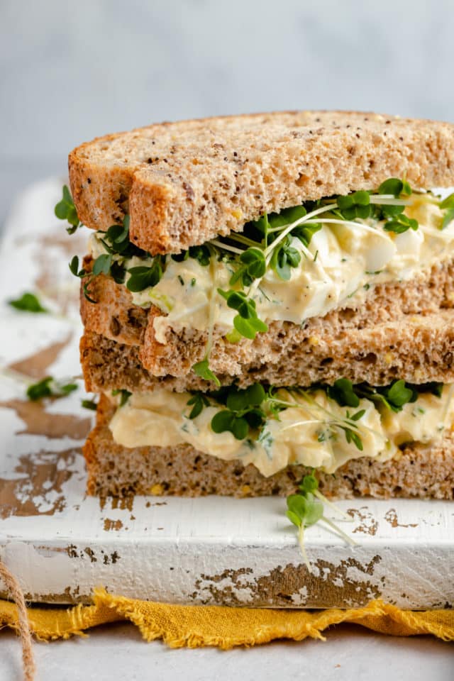 healthy egg salad sandwich served on wheat bread 