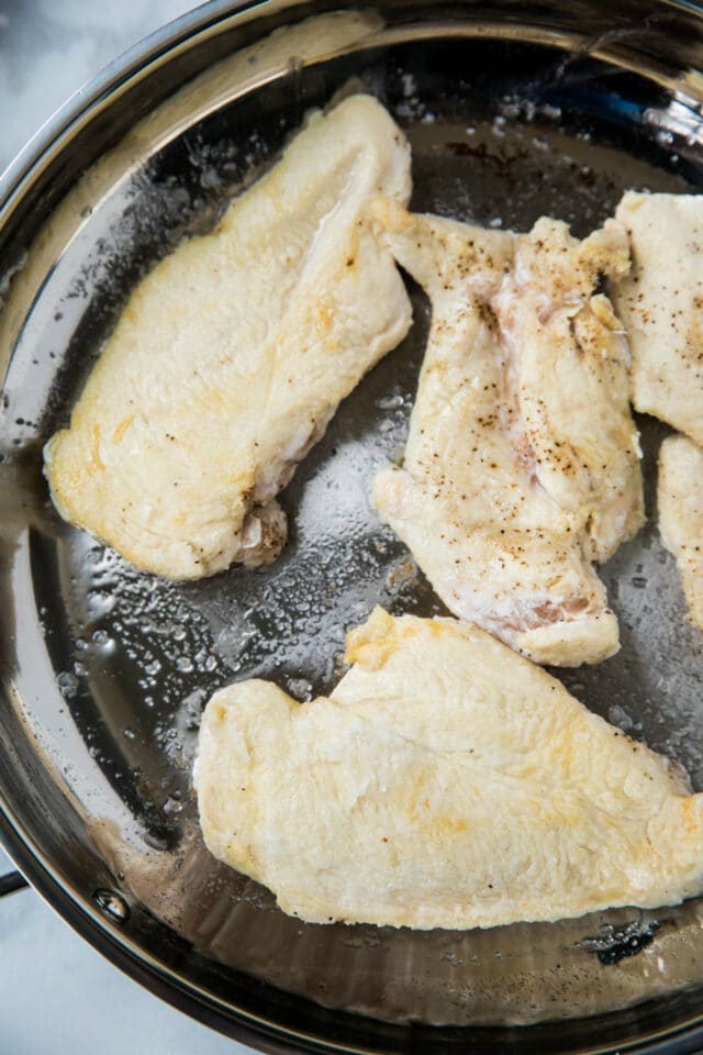 browning chicken in a large skillet