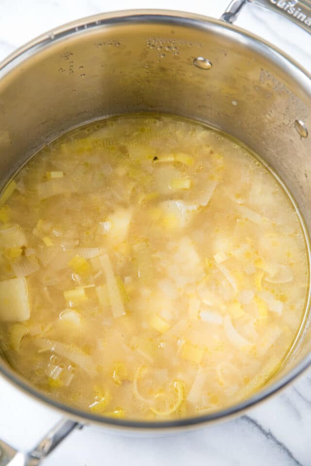 potato leek soup cooking in a large soup pot
