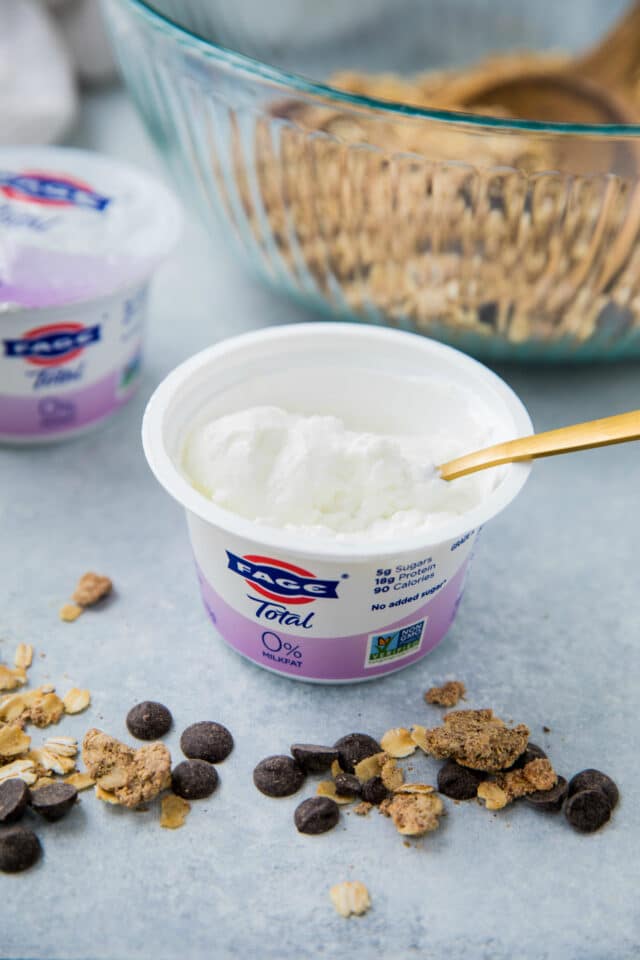 FAGE yogurt container with gold spoon