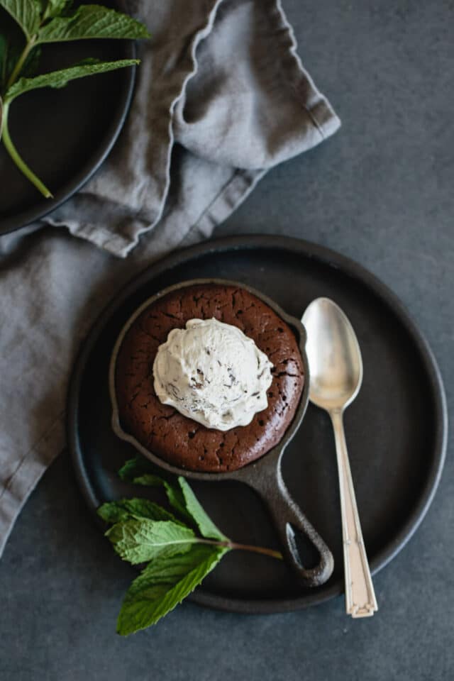 Mini Skillet Brownie topped with a scoop of vanilla ice cream