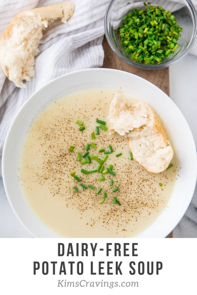 creamy soup topped with chives and pepper and served with crusty bread