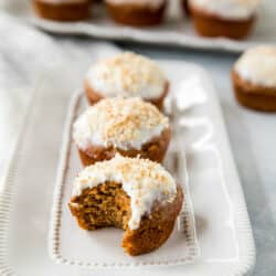 a carrot cake muffin with a bite out