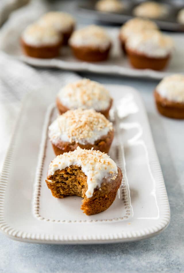 a carrot cake muffin with a bite out