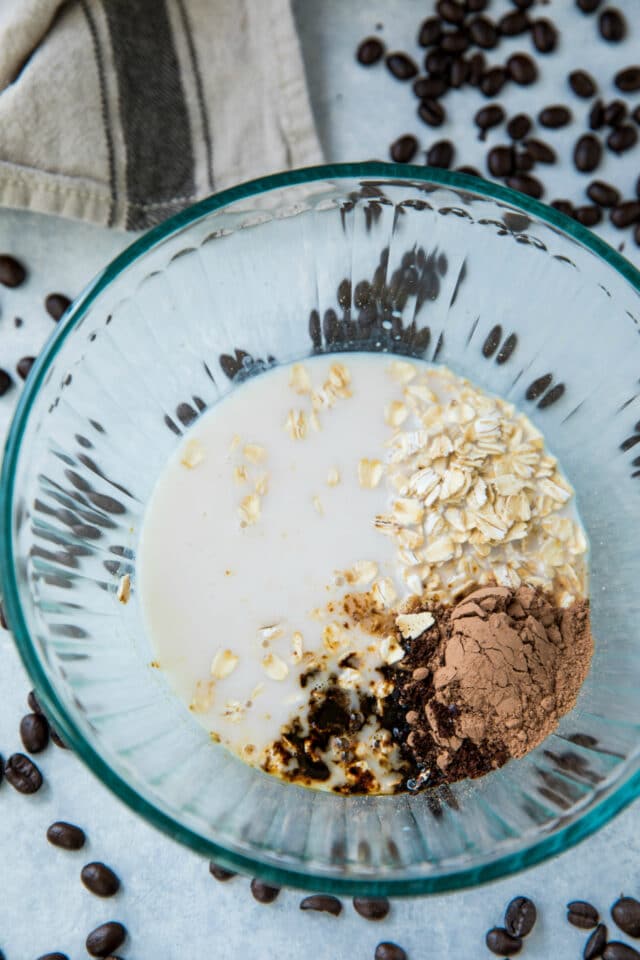 ingredients for mocha overnight oatmeal in a small glass mixing bowl
