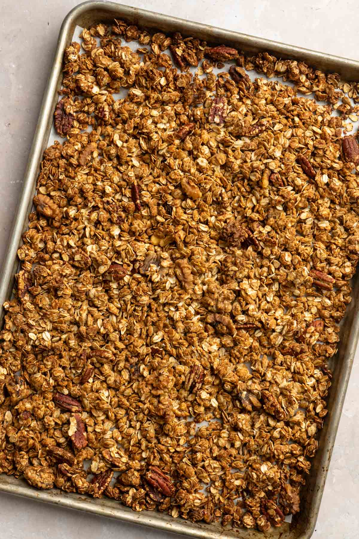Baked granola on a cookie sheet.