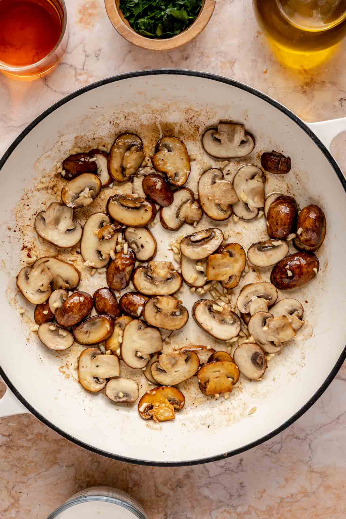 Sautéing mushrooms in a skillet.