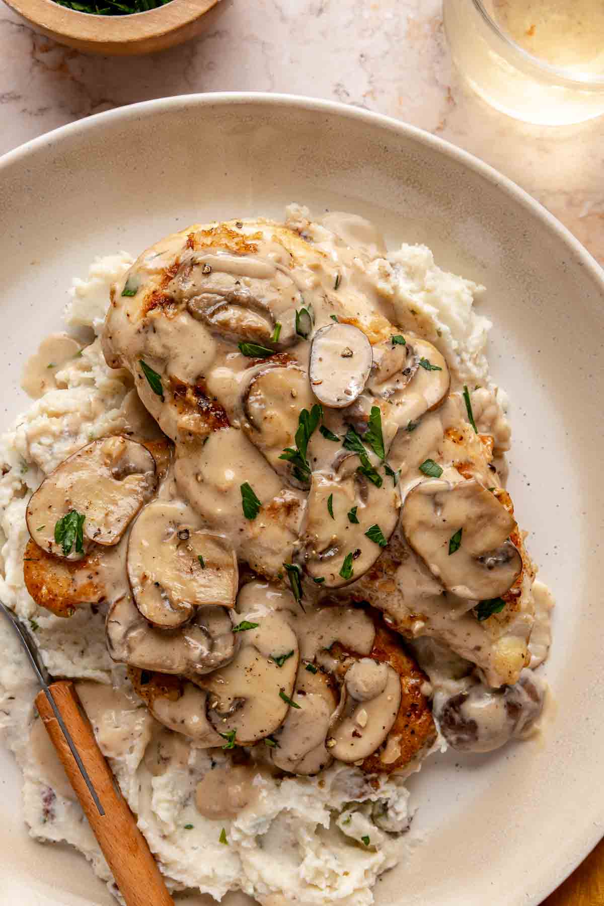 Chicken Marsala served over mashed potatoes.